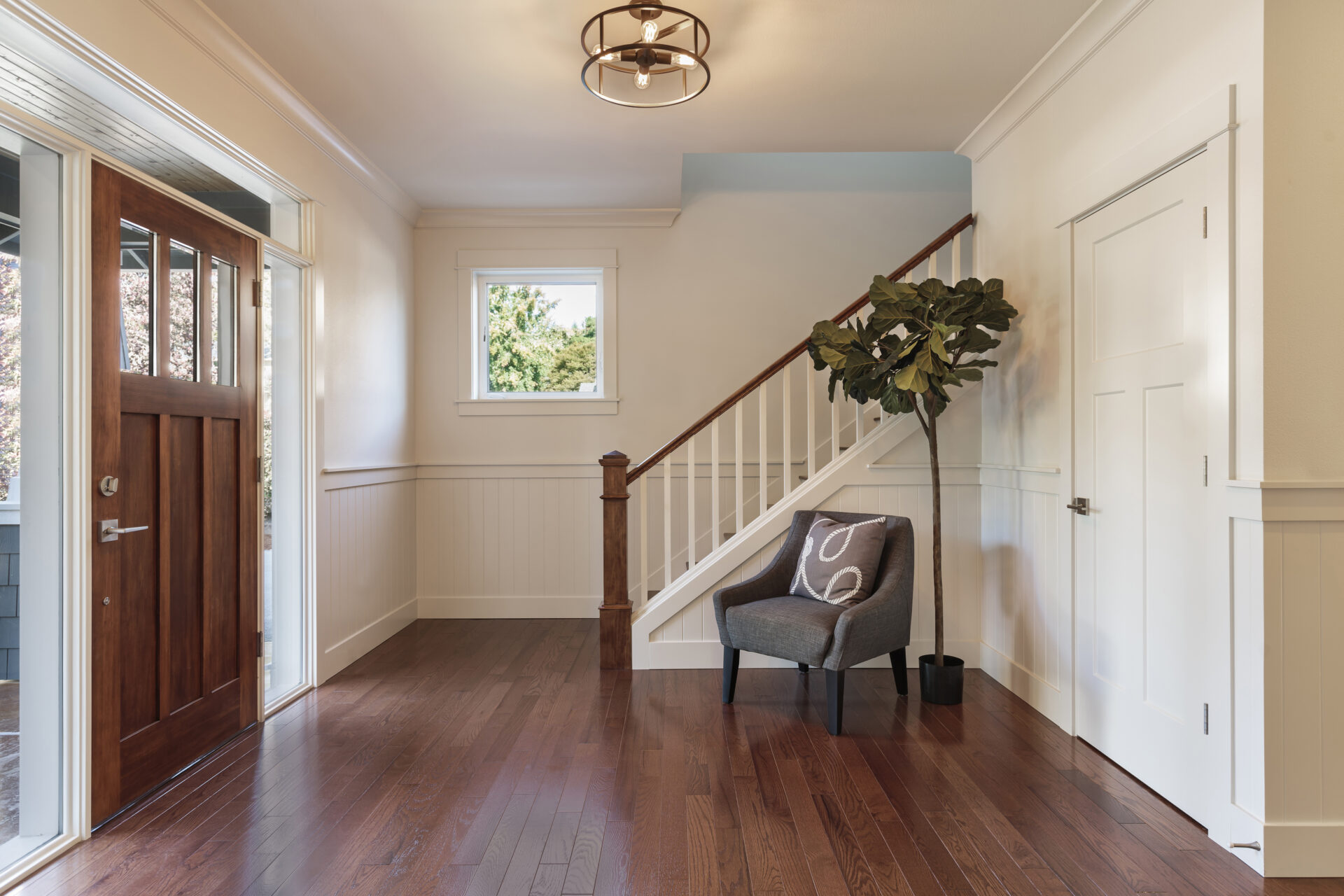A refinished hardwood floor gleaming under natural light, demonstrating the results of the process and answering the question, how long does it take to refinish hardwood floors?