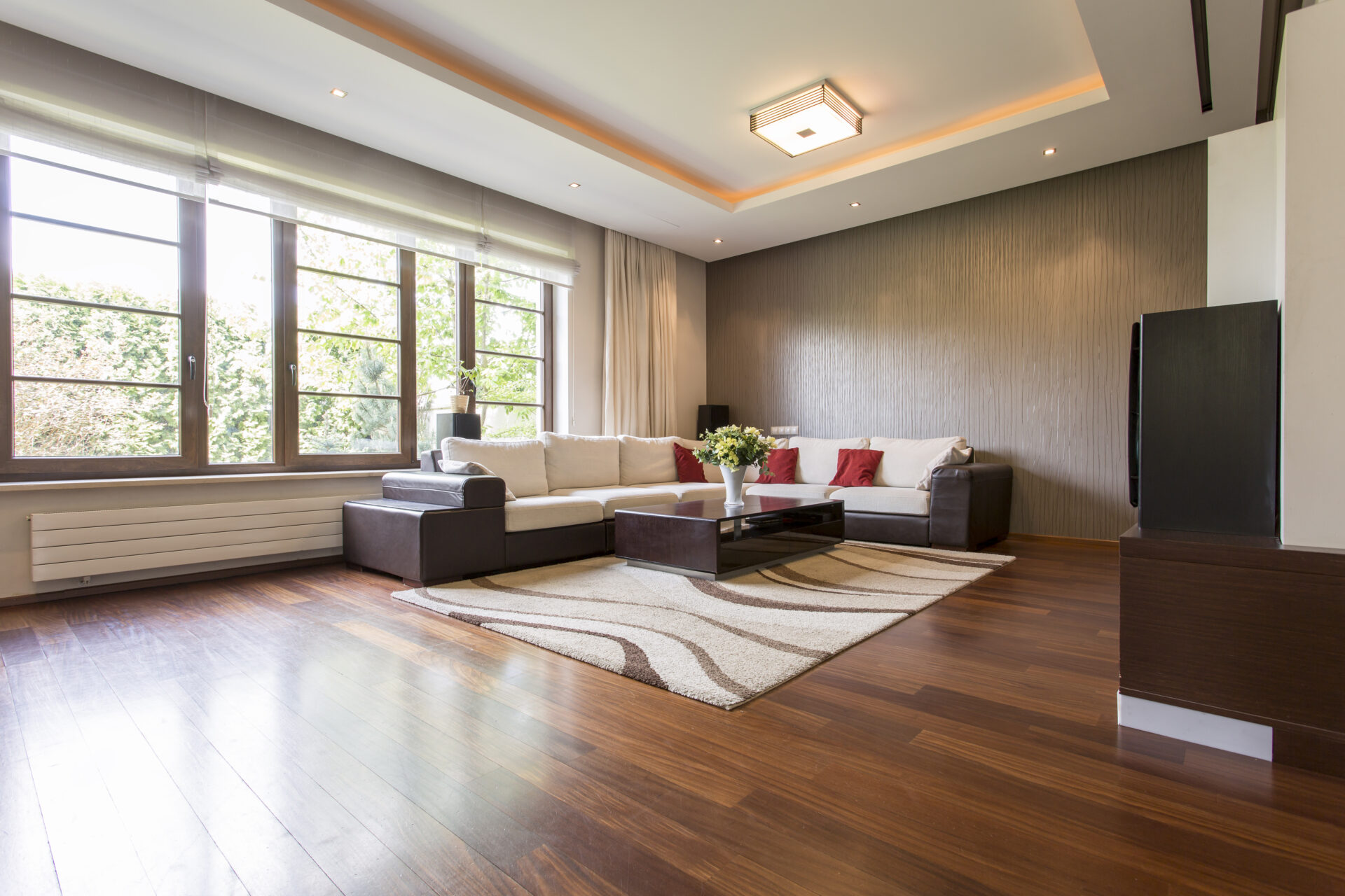 A modern living room after installing hardwood floors.
